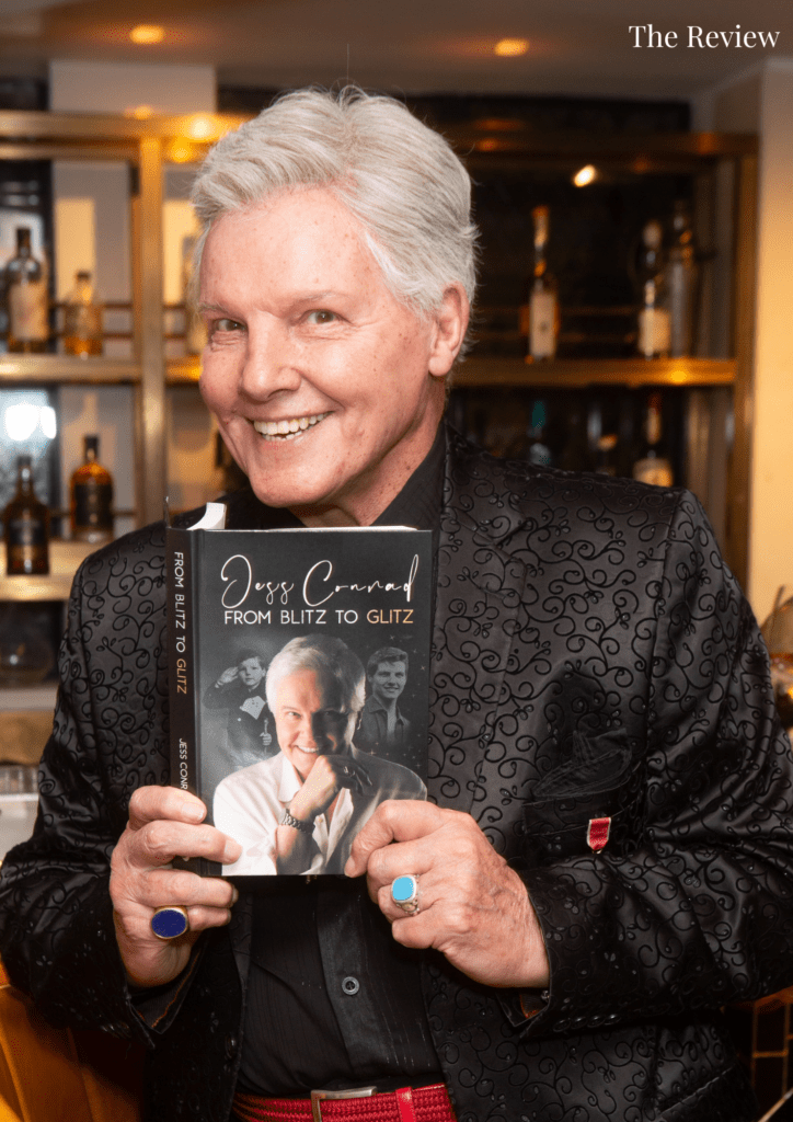"Explore Jess Conrad's remarkable journey from wartime London to showbiz stardom in 'From Blitz to Glitz' - a captivating autobiography!" 🌟📚
